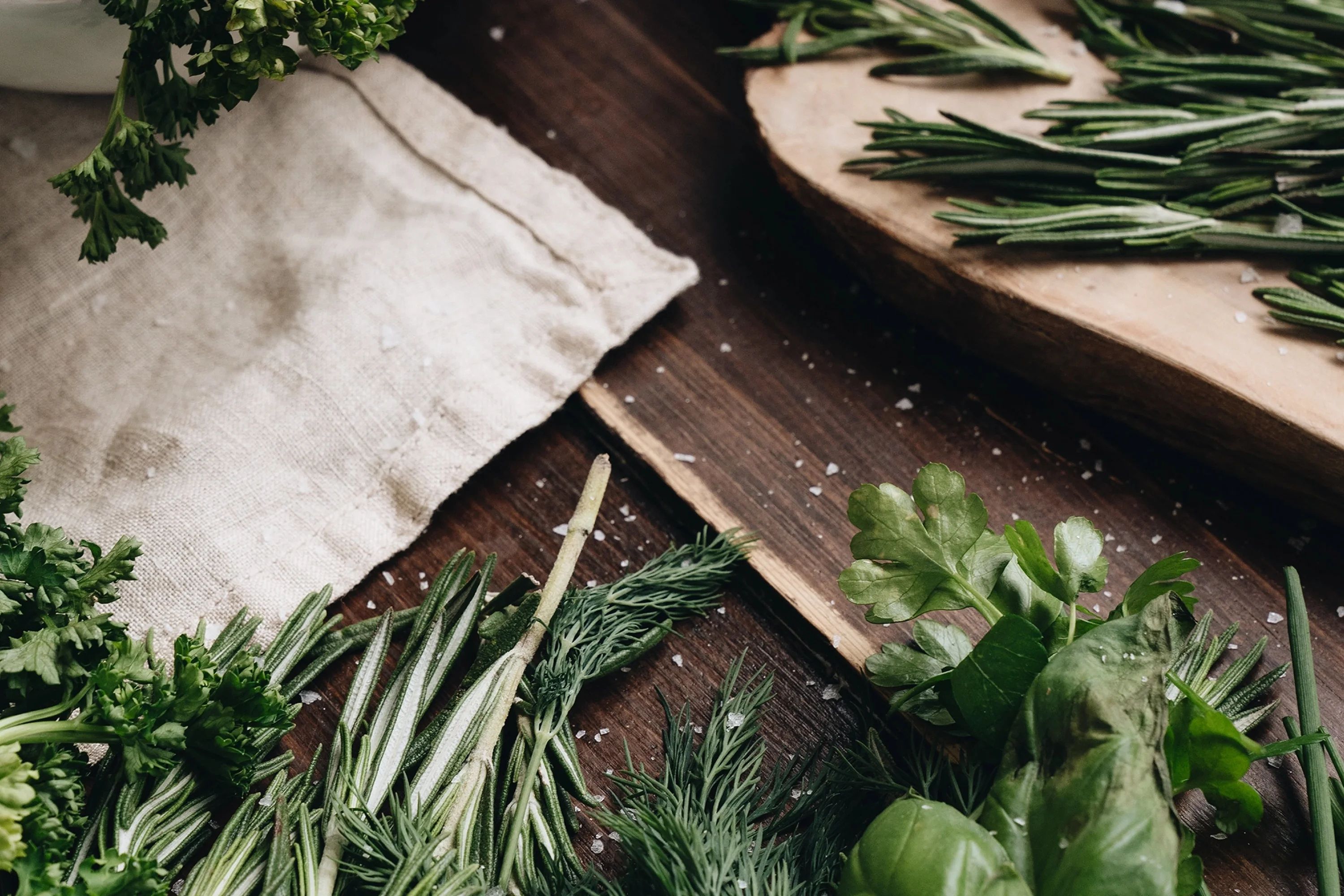 Cut up herbs on a cutting board