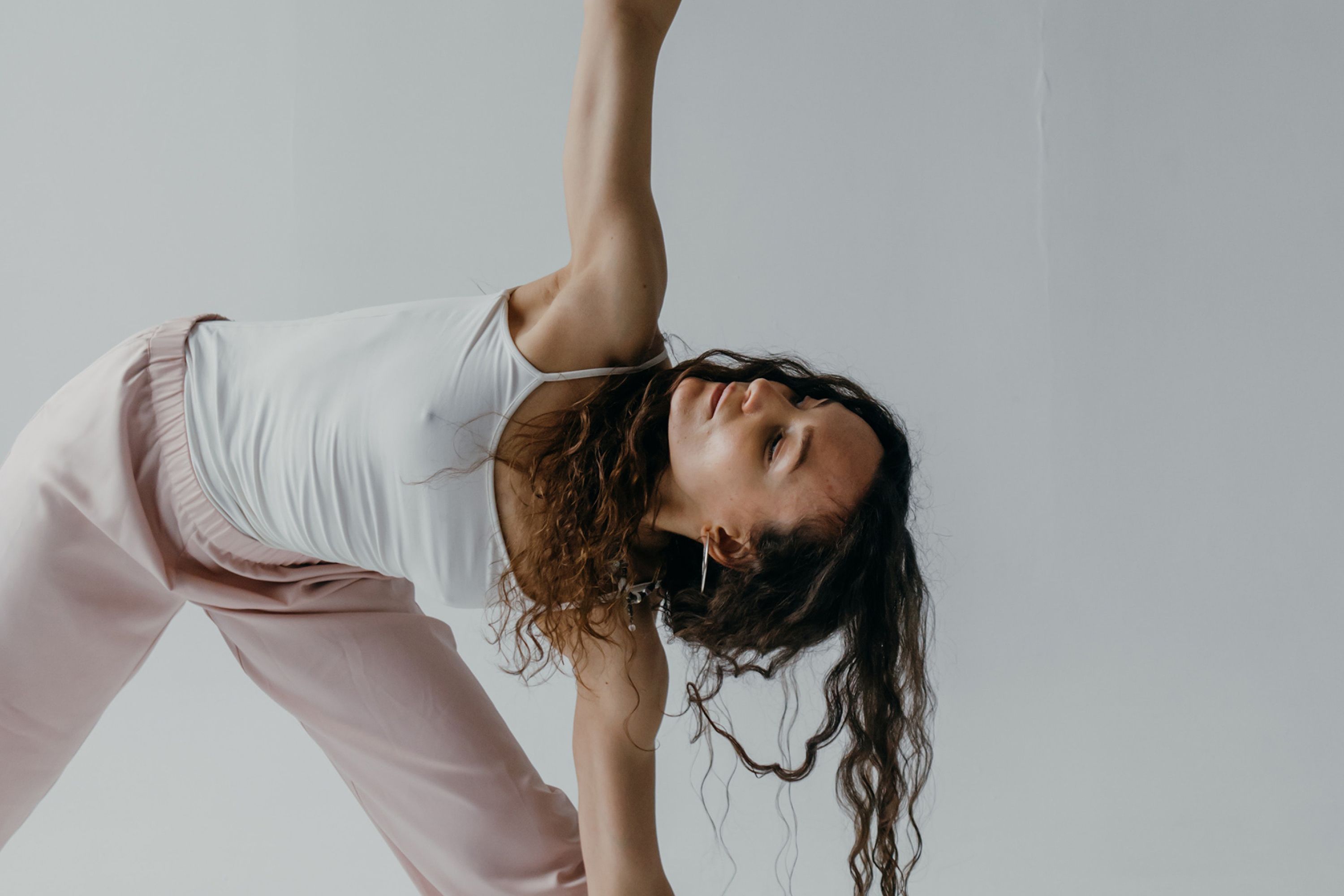 Lady doing yoga to manage stress