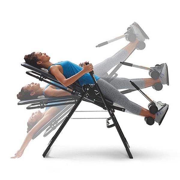 Woman using an inversion table for spinal decompression